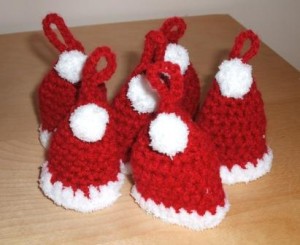 gatehring of crocheted mini santa hats